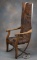 Antique oak Lodge Chair, designed to let back down by pulling rope so that person in the chair is fl