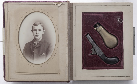 Engraved Percussion Derringer, Hidden Compartment in a Family Portrait Book.  Approximately .32 cali