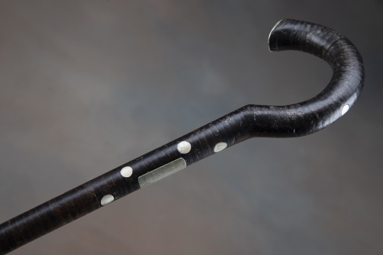 Vintage Cane made from leather washers with inlaid mother of pearl spots, 30" long with steel point 