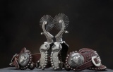 Magnificent, museum quality pair of double mounted silver overlay, hand engraved Spurs by noted West