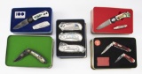 Group of Eight Lock Blade, Folding Knives in Picture Collector Tins, Limited Edition.  Most are in a