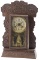 Antique Kitchen Clock with ornate oak case. Made by the New Haven Clock Company, circa 1910, origina