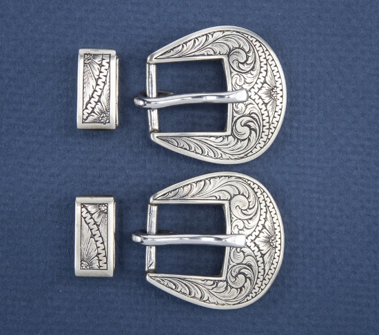 Scarce pair of hand engraved Strap Buckles and matching Keepers by Texas Bit and Spur Maker Russell