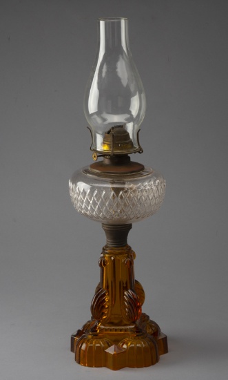 Antique amber to clear Victorian Oil Lamp, circa 1890-1910, 22" T with ornate embossed 6" amber base