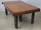 A very unique and desirable antique oak Harvest Table, circa 1900-1910, with four self storing 11