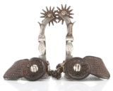 Pair of vintage single mounted California Spurs with heavy hand engraved silver overlay on heel band
