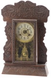 Antique Kitchen Clock with ornate oak case. Made by the New Haven Clock Company, circa 1910, origina