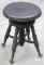 Antique Piano Stool with revolving adjustable top, glass Tiffany style glass ball and claw feet, ori