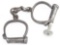 Pair of early Wrist Restraints with key, marked 