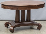 Beautiful antique, oval Library Table, circa 1900-1910, with solid mahogany top with hide away drawe