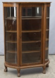 Antique, triple curved glass oak, claw foot China Cabinet, circa 1910, measures 62