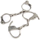 Two pairs of early Hand Cuffs, one is marked 