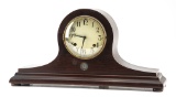 Walnut case, hump back Clock, circa 1920s-30s, by New Haven Clock Co., with original pendulum and ke