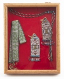 Wooden and glass front Showcase containing a Necklace, one Sash and two drops, all are glass beaded.