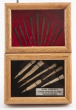 This  consists of two small wooden and glass Showcases.  One contains seven Bone Punches from graves