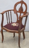 Unique antique Arm Chair (circa 1910), with needle point seat, original rollers, original finish and