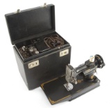 Cased Portable Singer Sewing Machine, Featherlite, with small fold out work table, in original case