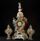 Antique four piece porcelain French Figural Clock, possibly Dresden with crossed swords markings. Th
