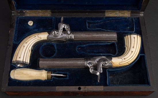 Pair of Cased antique, engraved French Single Shot Derringers with folding hide away triggers, 3" ba