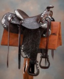Beautiful brown, heavily tooled Sterling mounted Saddle marked 