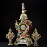 Antique four piece porcelain French Figural Clock, possibly Dresden with crossed swords markings. Th