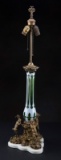 Beautiful antique Table Lamp with center piece of cased white cut to green emerald glass, supported