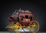 Miniature die cast of Wells Fargo Overland Stage Coach, complete with luggage and coach guns, 10 1/2