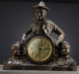 Two Will Rogers Character Clocks, one is electric in a bronze finish, one is key wind in a gold fini