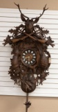 Walnut, German Black Forest style, heavily carved Cuckoo Clock with large stag head crest, carved ri