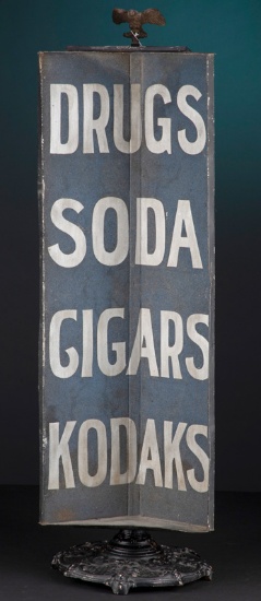 Early tin, revolving Trade Sign on fancy cast iron base, circa turn of the