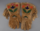 Pair of Wild West beaded Gauntlets with fringed border, circa 1920s, showin