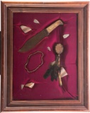 Framed collection of Artifacts in shadow box frame that measures 30