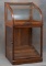 Antique country store oak and glass Cane Case with curved glass lift top, appears to be in original