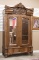 Incredible antique quarter sawn oak, double, beveled mirrored doored Wardrobe with claw foot double