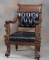 Unique antique quarter sawn oak, claw foot Arm Chair with heavily carved arm supports, circa 1900, v