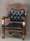 Fine antique, quarter sawn oak Arm Chair, circa 1900, with carved ladies face and floral carving in