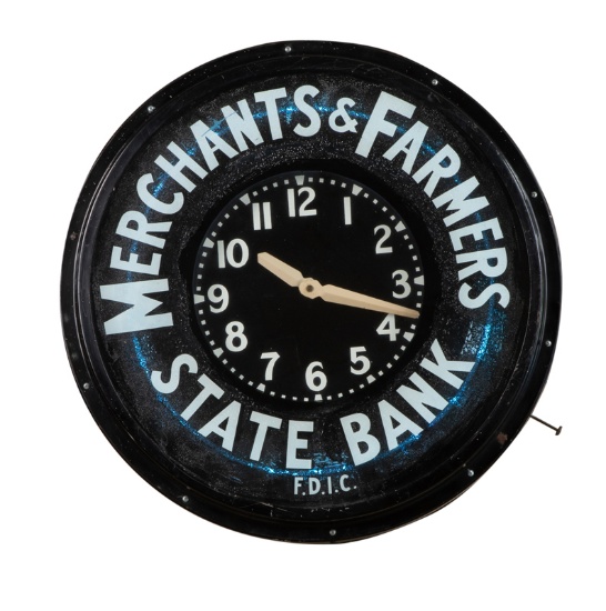 Vintage and historic, round metal Wall Clock with blue neon back light. This clock hung in the Merch