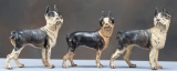 This lot consist of a collection of three vintage cast iron Bull Dog Door Stops. One small one measu