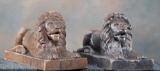 Matched pair of vintage laying lion entry pieces marked 