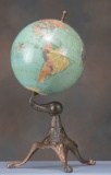 Antique World Globe on cast iron footed base that retains much of its original copper plating. Globe