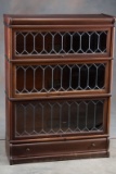Antique mahogany leaded glass, three Stack Lawyer Bookcase, circa 1915-1920, marked 