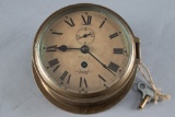 Antique brass Ships Clock, spring driven movement, paper dial marked 