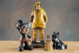 This lot consists of four cast iron pieces to include: (1) Mickey Mouse Penny Bank, 9 1/4