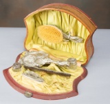 Antique celluloid and silver Dresser Set in celluloid case, consists of hand mirror with embossed la
