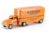 This lot consists of two vintage items to include:  (1) Tin Tractor Trailer Rig, is orange and marke
