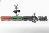 Seven piece cast iron Train Set includes Engine, Coal Tinder Car, three Passenger Cars and two Rail