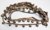 This lot consists of two sets of Sleigh Bells to include: (1) Leather belted brass Sleigh Bells with