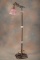 Ornate antique Floor Lamp, circa 1920s, with desirable turkey foot base. Lamp is complete with the a