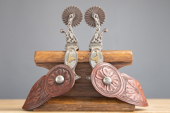 Pair of "Kevin Peebler" marked double mounted hand engraved Spurs with silver overlay. Spurs have ra