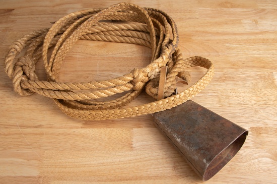 Most unusual braided Bull Riding Strap, complete with iron bell. Rope measures 12 ft. 6" long. THE L